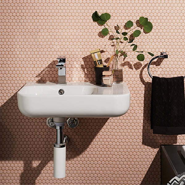 Caroma Luna gloss white wall-hung shelf basin 550mm, rectangular with no taphole, styled in a bathroom setting