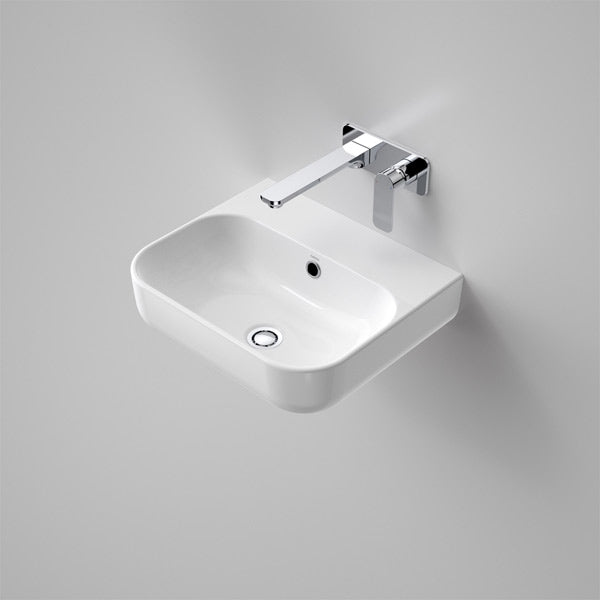 Caroma Luna white wall hung ceramic basin with rounded rectangular shape and rear landing, shown with mixer tap