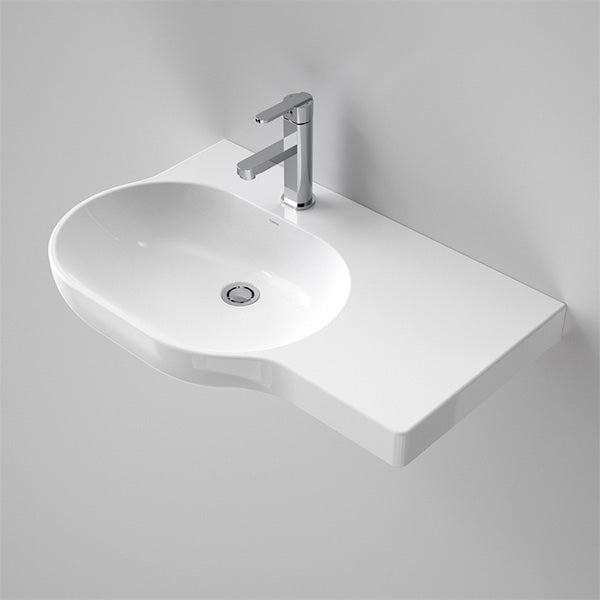Caroma Opal wall-hung oval basin in white, with left-hand shelf and chrome mixer tap throughout.