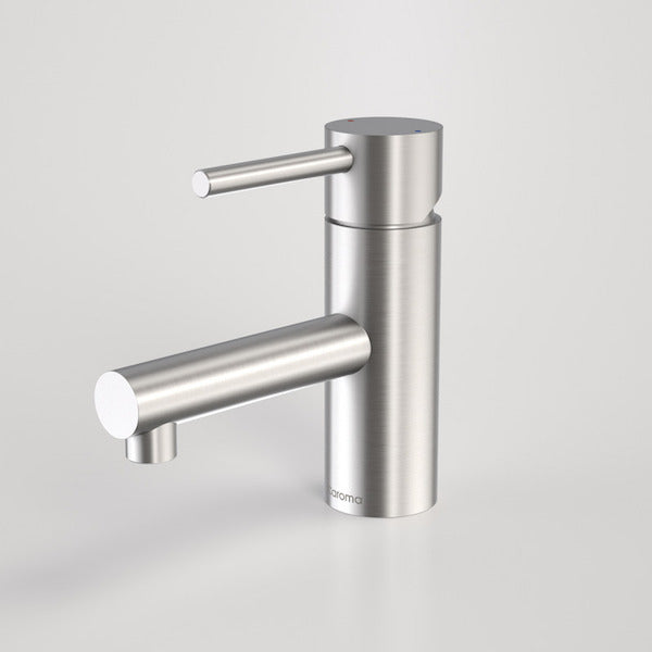 Caroma Titan stainless steel basin mixer tap in satin finish, shown on a plain background, hob mounted, side view