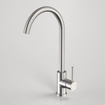 Caroma Titan stainless steel gooseneck sink mixer tap with swivel spout and side lever, satin finish on grey background