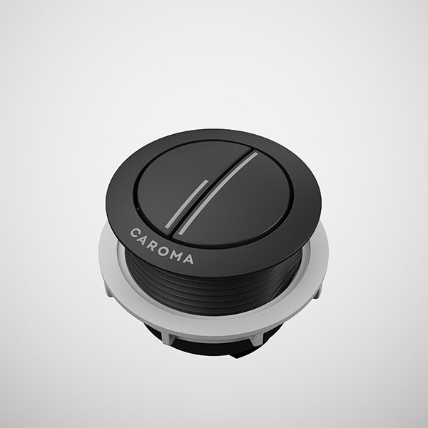 Caroma round cistern flush button in matte black metal with silver accent, shown on white background