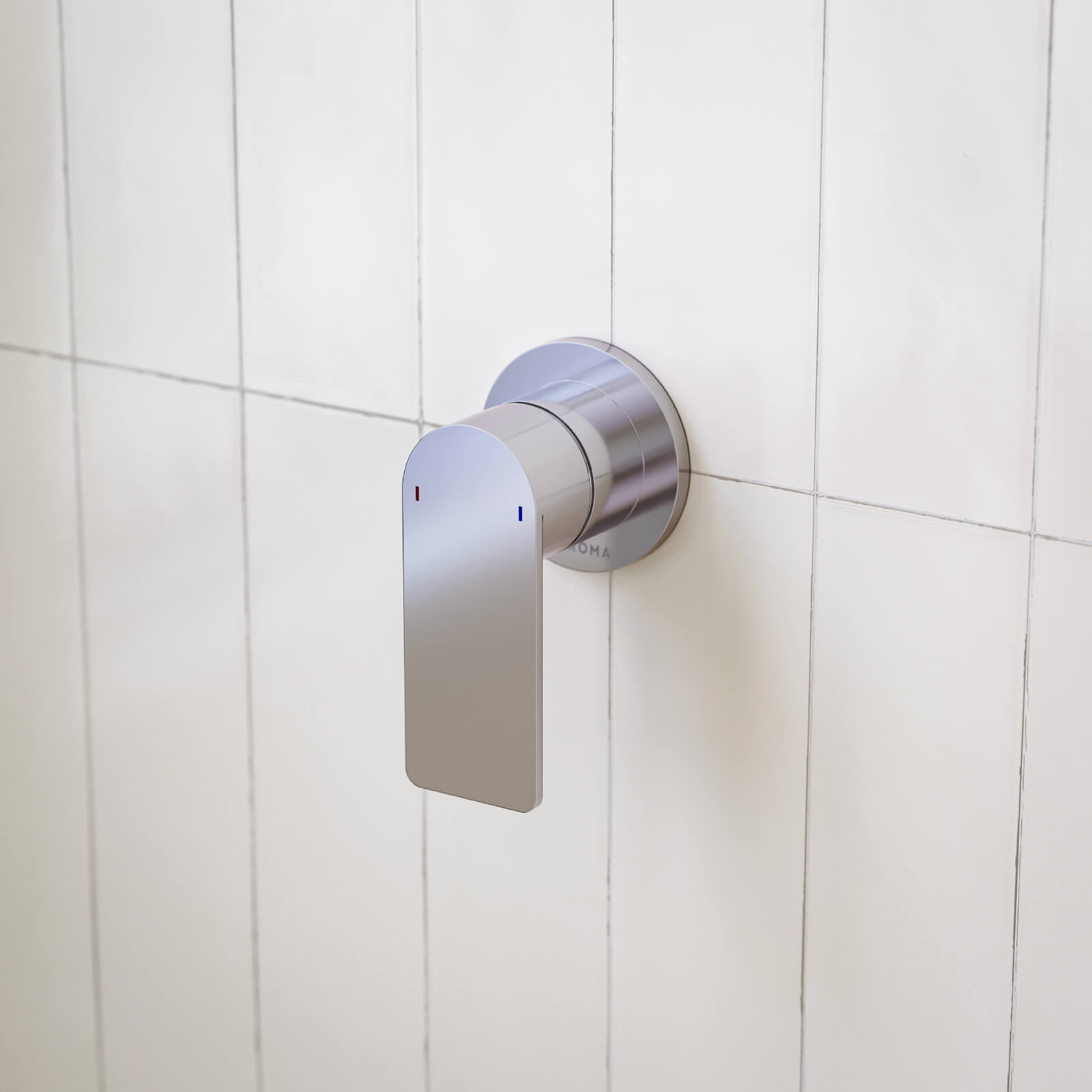 Caroma Urbane II round chrome bath/shower mixer, wall-mounted lever tap on white tiled bathroom wall