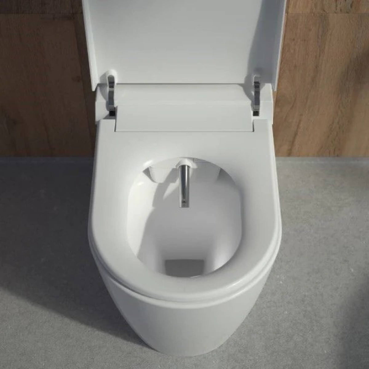 Caroma Urbane II wall faced bidet suite in white, top view with raised toilet seat and chrome bidet nozzle