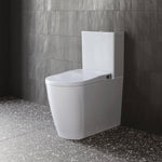 Caroma Urbane II white wall-faced close coupled bidet toilet suite in a modern bathroom, front angled view