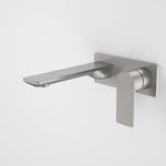 Caroma Urbane II wall basin/bath mixer with rectangular spout in gunmetal, shown against a white wall
