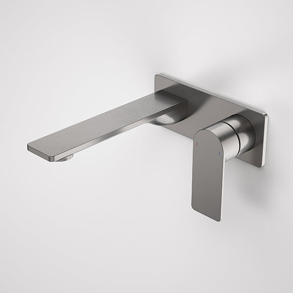 Caroma Urbane II wall basin/bath mixer in gunmetal with rectangular plate and slim spout, shown front on against white background