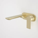 Caroma Urbane II wall basin/bath mixer in brushed brass, round wall-mounted tap with lever handle