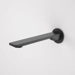 Caroma Urbane II round wall-mounted basin/bath outlet in matte black, side view with 220mm straight spout