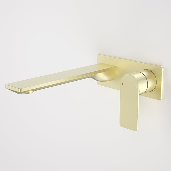 Caroma Urbane II wall basin/bath mixer in brushed brass, with rectangular spout and lever handle on wall plate