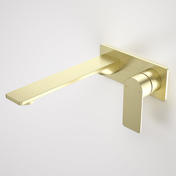 Caroma Urbane II wall basin/bath mixer in brushed brass with slim rectangular spout and lever handle