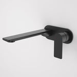 Caroma Urbane II wall basin mixer in matte black, round wall-mounted tap with long spout and lever handle