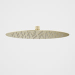 Caroma 300mm round rain shower head in brushed brass, shown front on against a white background