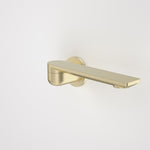 Caroma Urbane II round bath swivel outlet in brushed brass, side view, with 220mm long spout