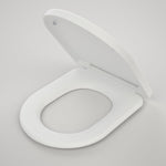 Caroma Urbane II white toilet seat with lid, soft-close, shown open in angled view on a plain background