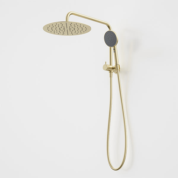 Caroma Urbane II twin shower in brushed brass, with round overhead drencher and handheld shower on wall mount