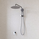 Caroma Urbane II twin shower in gunmetal, with round overhead rose, handset and wall mixer on tiled bathroom wall