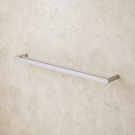 Caroma Urbane II double towel rail in brushed nickel, wall-mounted on tiled bathroom wall