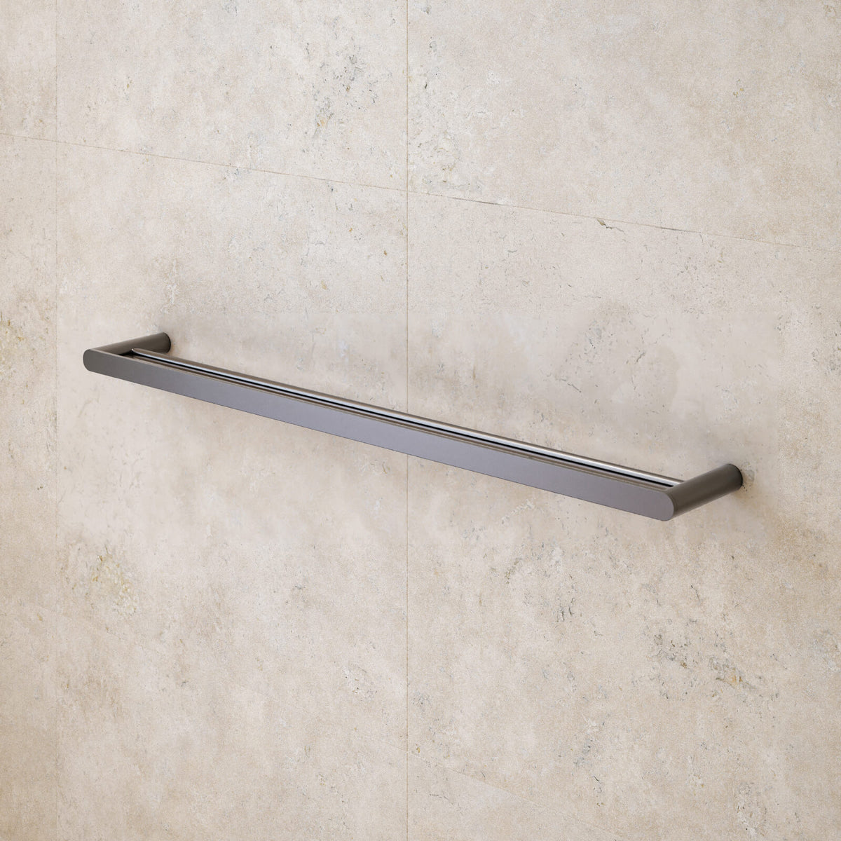 Caroma Urbane II double towel rail in gunmetal, mounted on a tiled bathroom wall