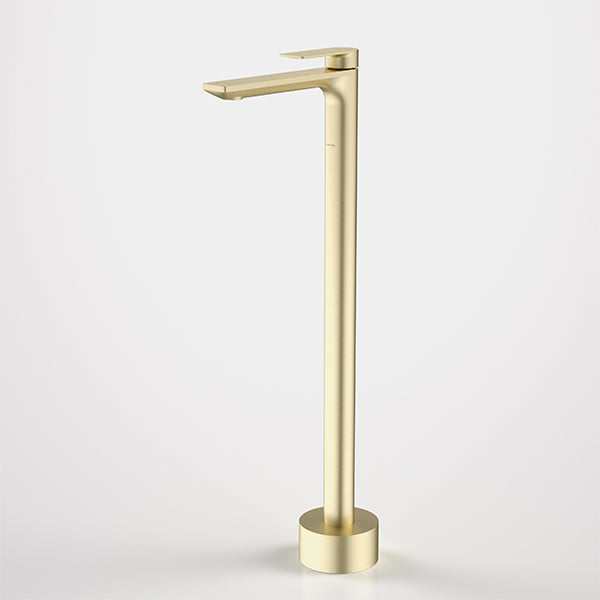 Caroma Urbane II floor-mounted bath filler in brushed brass, shown on a white background