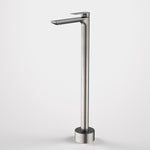Caroma Urbane II freestanding bath filler tap in gunmetal, floor-mounted with rectangular spout and slim column