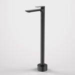 Caroma Urbane II freestanding bath filler tap in matte black, floor-mounted with tall rectangular spout and round base