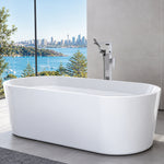 Caroma white freestanding oval bath in a modern bathroom with floor-mounted tap and harbour view