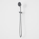 Caroma Urbane II chrome hand shower with round head, wall bracket and hose, shown on a white background