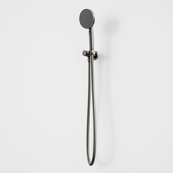 Caroma Urbane II round hand shower in gunmetal with wall bracket and silver hose on a white background