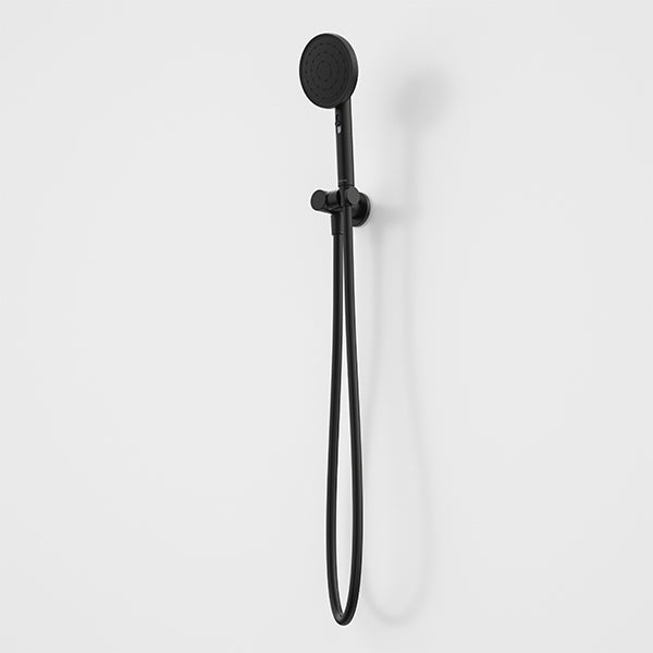 Caroma Urbane II matte black hand shower with round head, hose and wall bracket on a white background