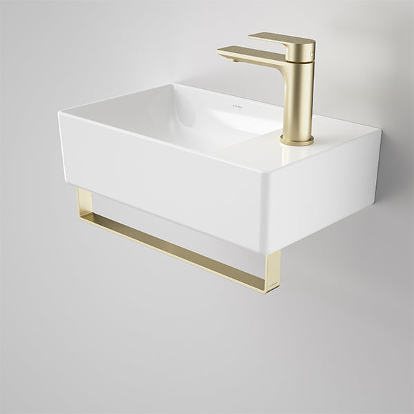 Caroma Urbane II gloss white wall-hung hand basin with single tap hole and gold integrated rail
