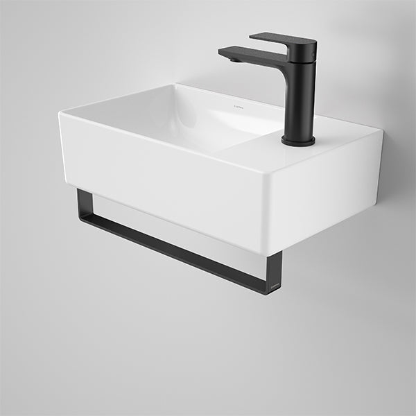 Caroma Urbane II wall hung hand basin, gloss white rectangular ceramic with black mixer tap and rail