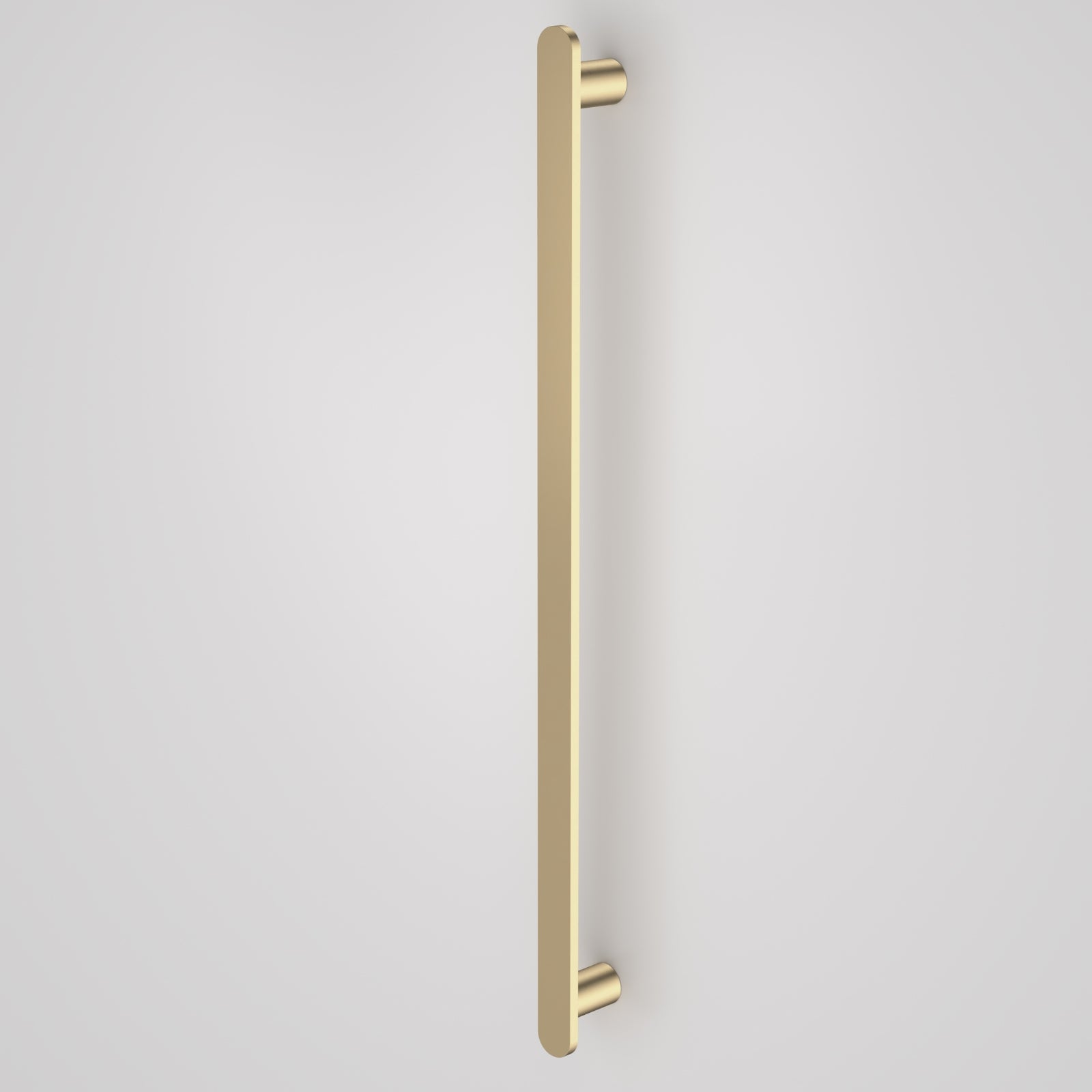 Caroma Urbane II vertical heated towel rail in brushed brass, slim single-bar wall mount on a plain background
