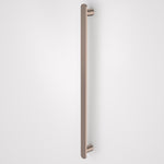 Caroma Urbane II vertical heated towel rail in brushed bronze, single round bar on white background