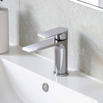 Caroma Urbane II chrome basin mixer on a white hob-mounted basin, shown in a bathroom vanity setting