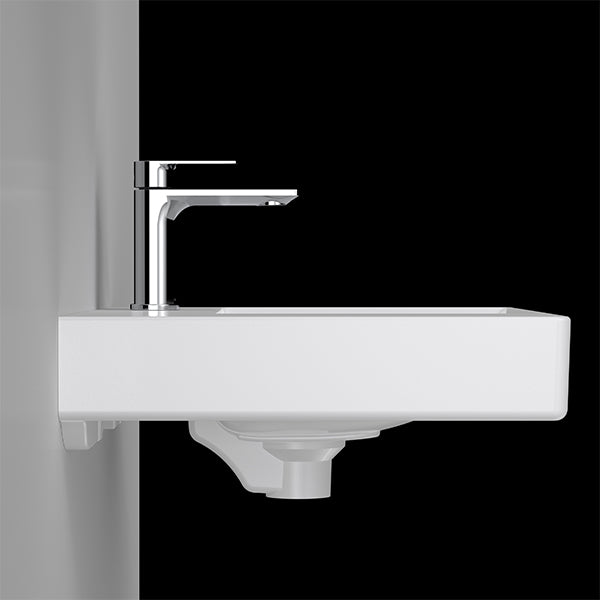 Caroma Urbane II white wall-hung basin with left-hand shelf and chrome mixer tap, side view