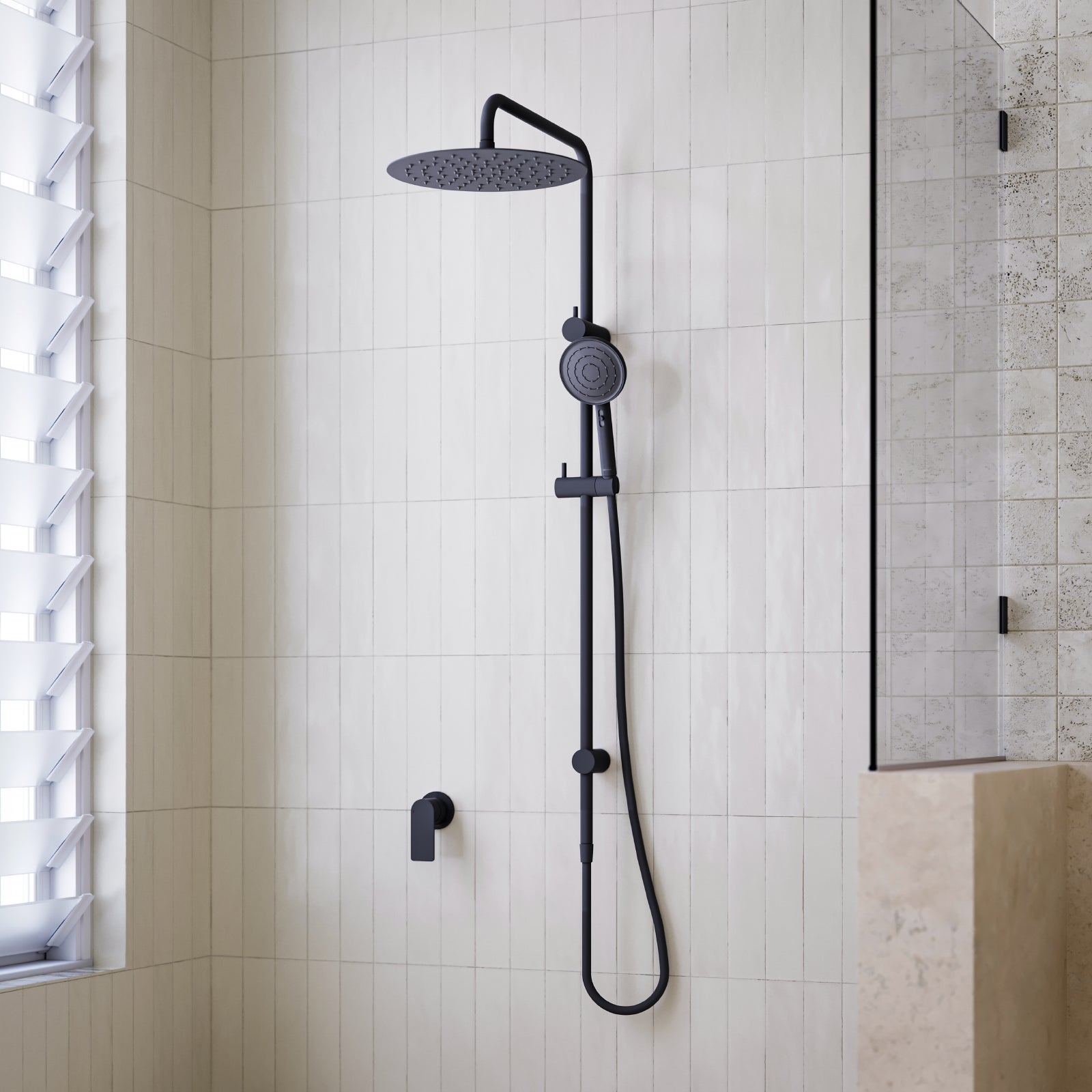 Caroma Urbane II matte black twin rail shower with round overhead drencher and handheld shower in tiled bathroom