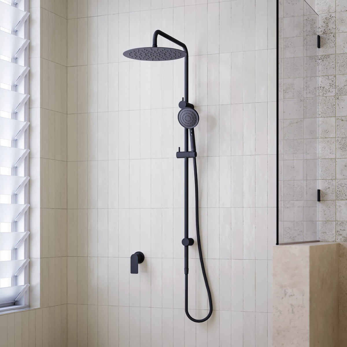 Caroma Urbane II matte black twin rail shower with round overhead drencher and handheld shower in tiled bathroom