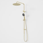 Caroma Urbane II twin rail shower in brushed brass, with round overhead drencher, handset and slide rail on white background