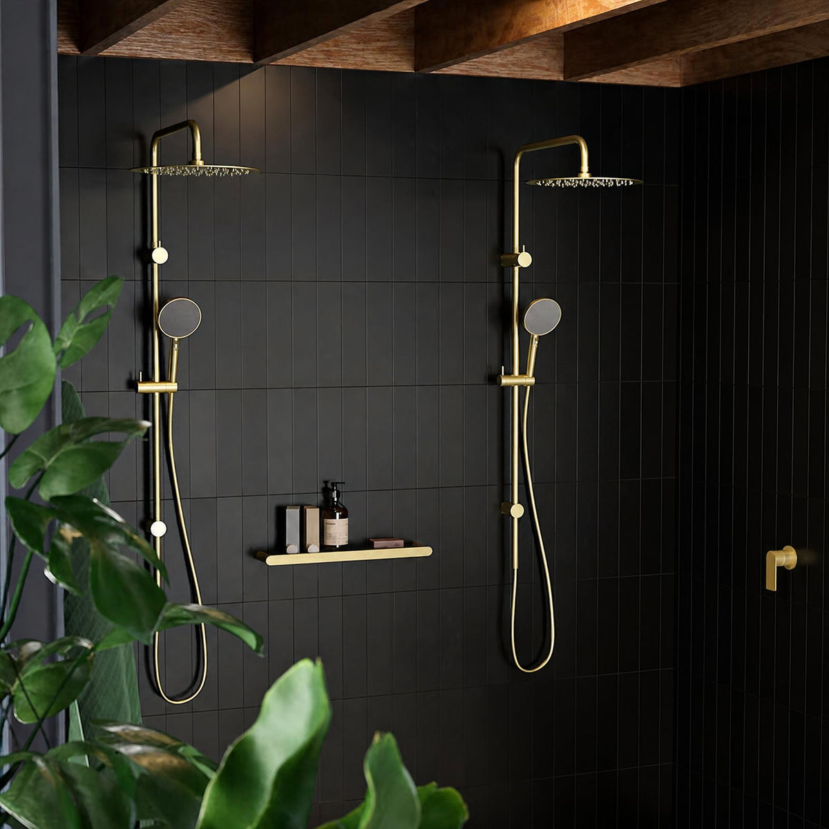 Caroma Urbane II brushed brass twin rail shower with round overheads and handsets in a black tiled bathroom setting