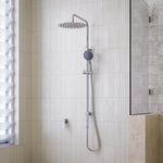 Caroma Urbane II chrome twin rail shower with overhead rain shower and hand shower in a tiled bathroom