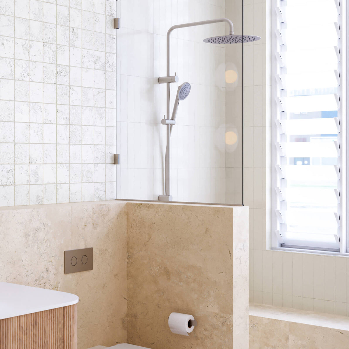 Caroma Urbane II chrome twin rail shower with overhead rose and handheld spray in a modern bathroom