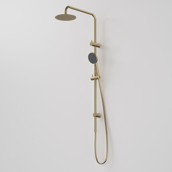 Caroma Urbane II rail shower with 200mm overhead in brushed brass, wall-mounted twin shower on white wall
