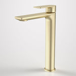 Caroma Urbane II tall basin mixer in brushed brass, single-lever tower tap on white background