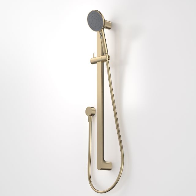 Caroma Urbane II universal rail shower in brushed brass, with round hand shower, slider and hose on wall rail