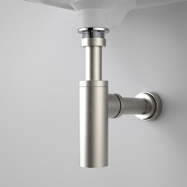 Caroma 40mm bottle trap in brushed nickel, fitted under a wall-hung basin