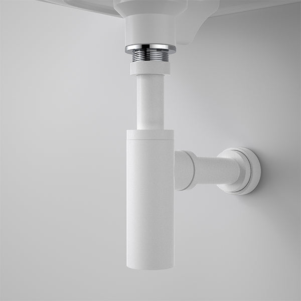 Caroma 40mm bottle trap in matte white under wall-hung basin, showing exposed pipework and round wall connection