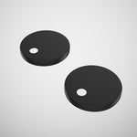 Caroma matte black toilet seat hinge caps, pair of round replacement covers on white background
