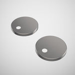 Caroma toilet seat hinge caps in gunmetal, shown as a pair of round covers on a white background