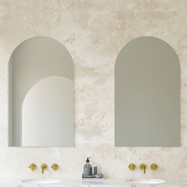 Timberline Church arched bathroom mirror with satin white edging, shown above a vanity in a bathroom setting